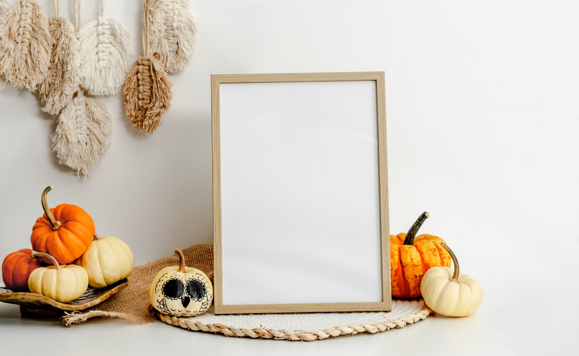 Wooden frame with orange ripe pumpkins